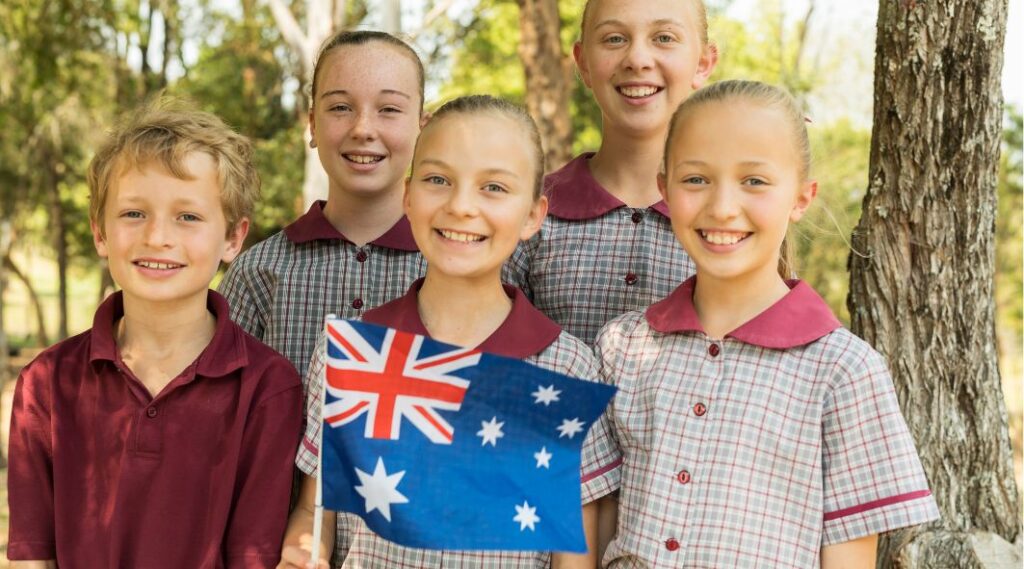 Move to Australia with kids - children with Australia flag 