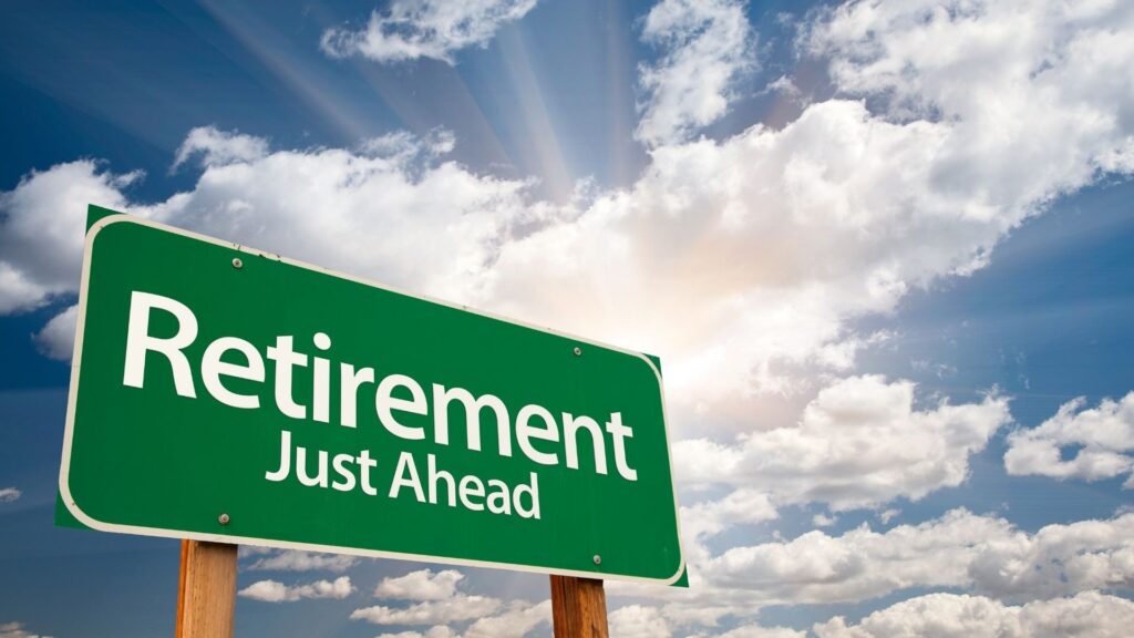 Green road sign reading Retirement Just Ahead symbolising the question am I ready to retire and what comes next